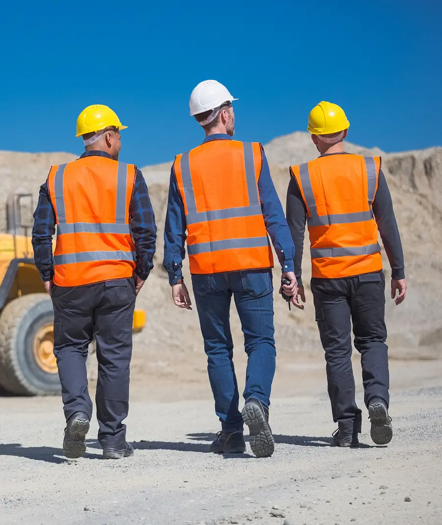 Construction workers walking on job site
