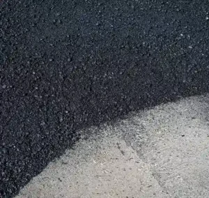 Freshly installed asphalt paving on commercial roadway