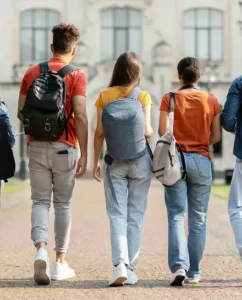 Students walking together on a campus courtyard.