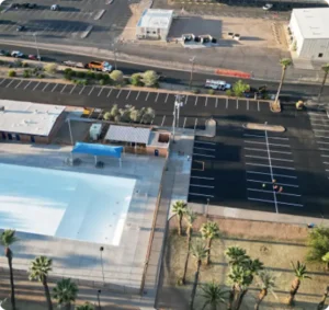 Aerial view of ADA-compliant parking lot after patching, striping, and asphalt repair