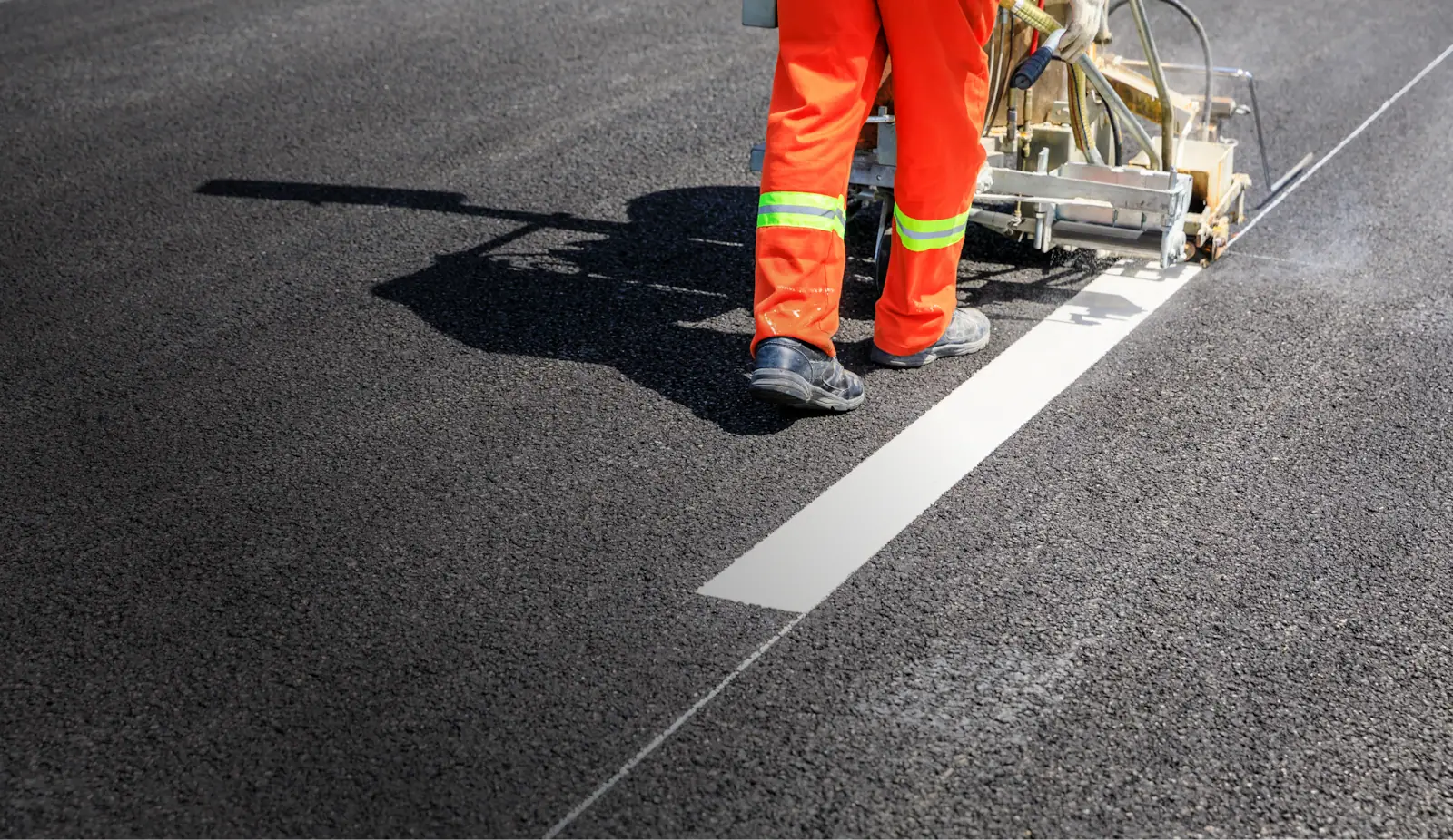Line striping on asphalt by professional paving crew
