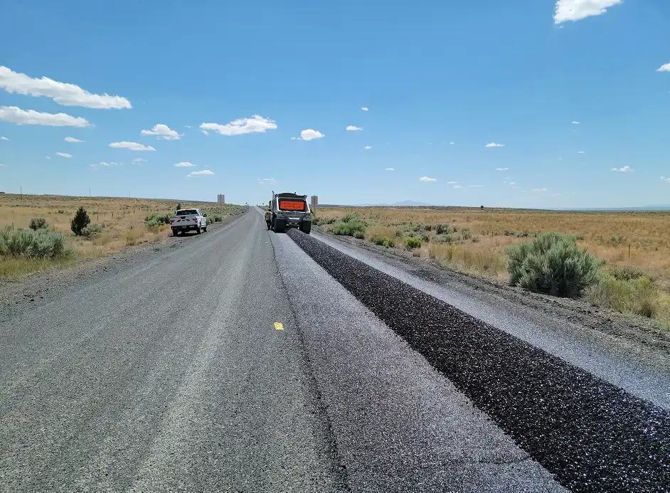 Freshly paved asphalt roadway in Arizona completed by Valor Paving repair and maintenance services.