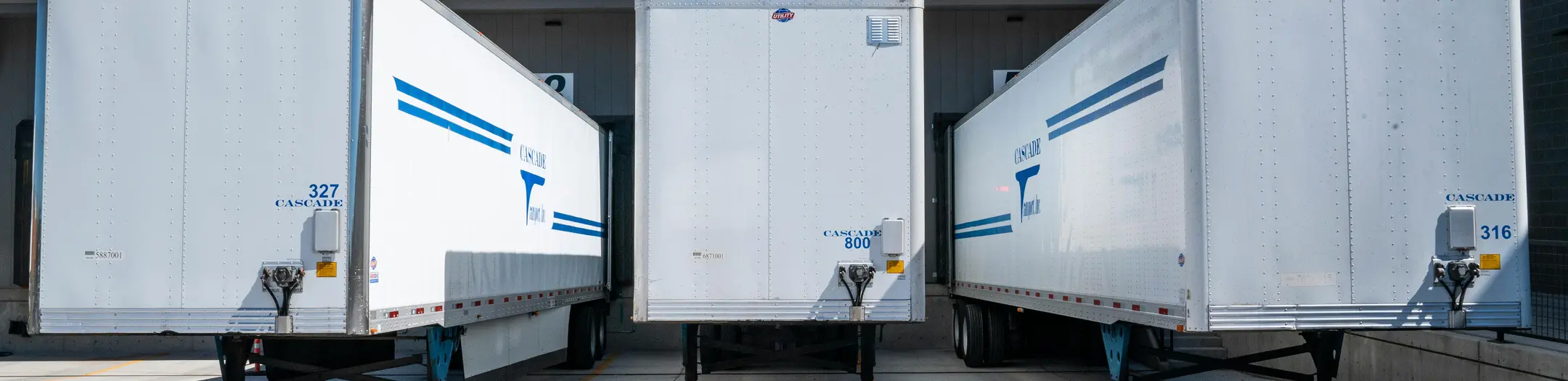 Semi-truck trailers parked at loading docks for freight operations in Phoenix, Arizona