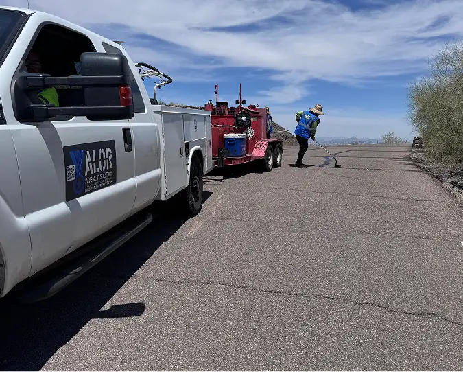 Valor Paving crew preparing asphalt on Arizona road, showing company values and integrity.