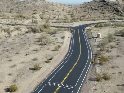 Freshly paved roadway at South Mountain Park in Phoenix, AZ, showing asphalt milling, patching, and striping work.