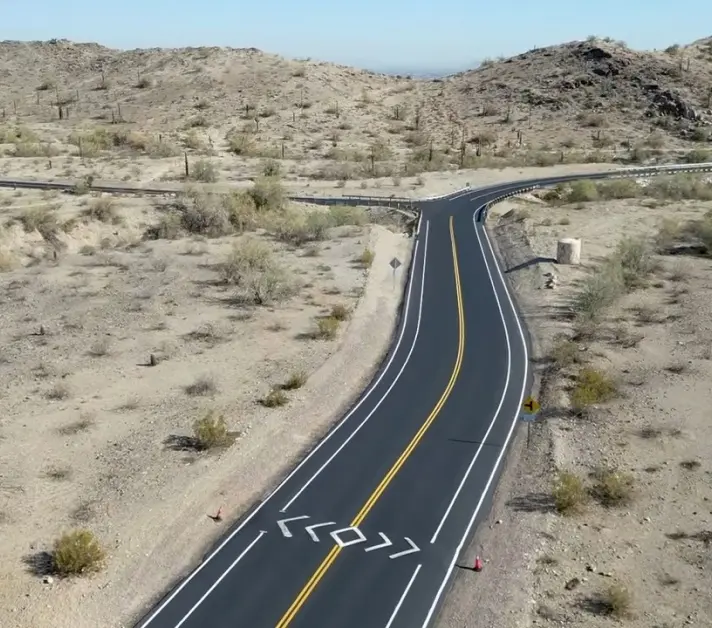 Freshly paved roadway at South Mountain Park in Phoenix, AZ, showing asphalt milling, patching, and striping work.