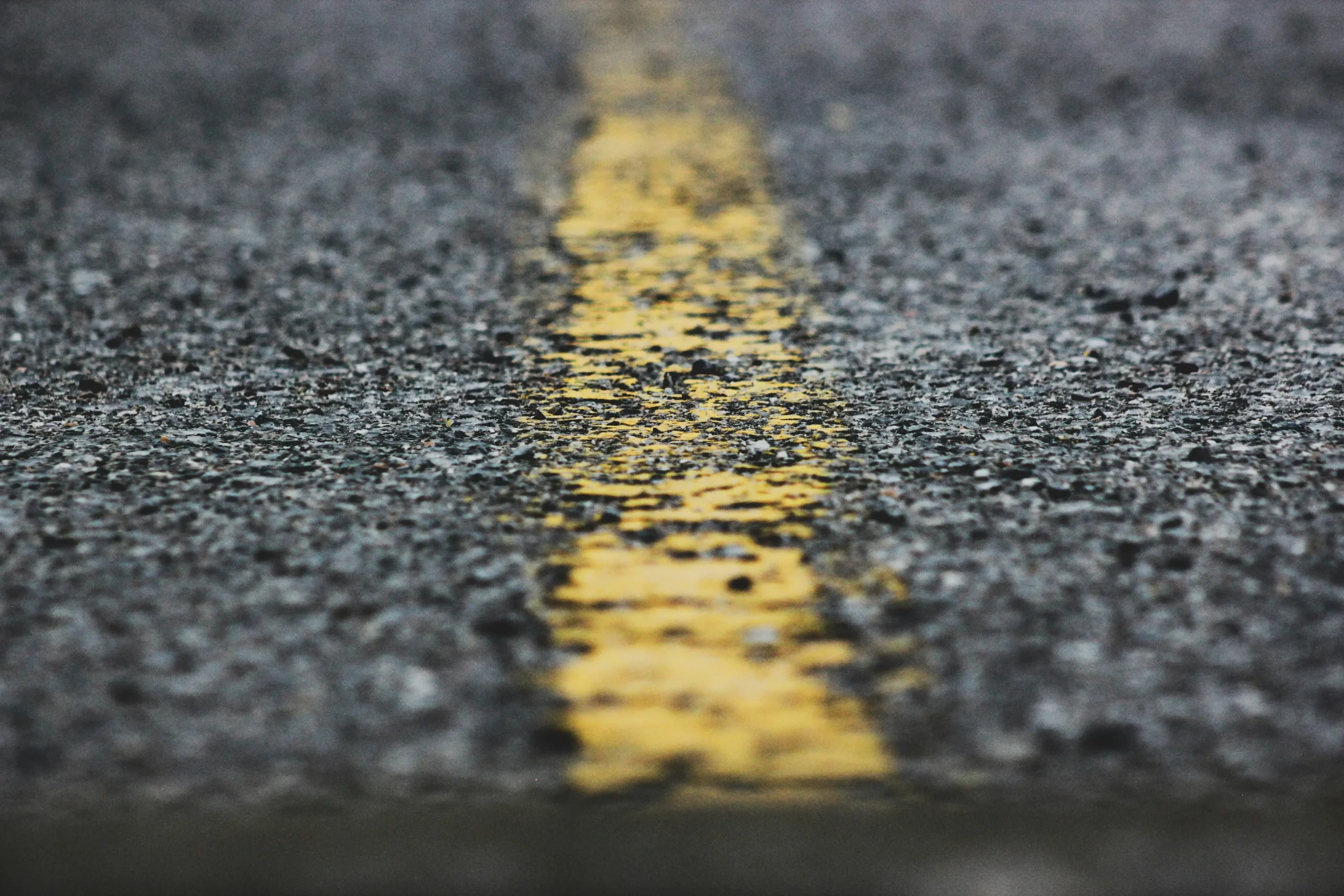 Faded parking lot striping and ADA markings
